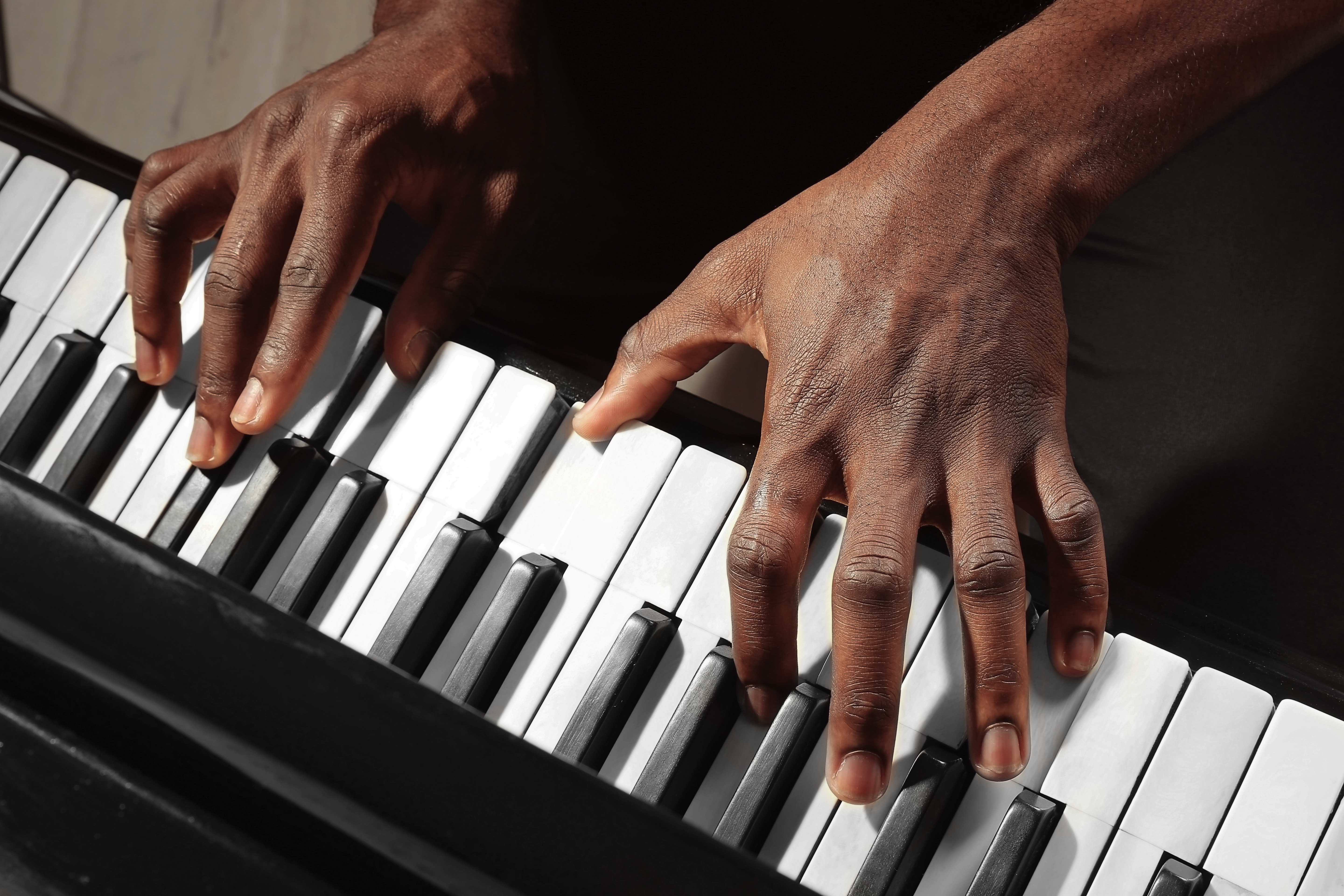 Logo related to Male pianists of Black African or Caribbean heritage